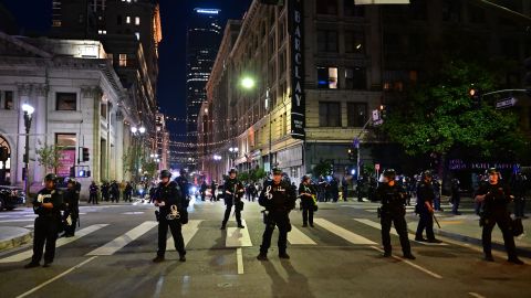 Police holding rubber-bullet guns and batons move to disperse a crowd of abortion rights activists protesting after the overturning of Roe Vs. Wade by the US Supreme Court, in Downtown Los Angeles, on June 24, 2022. - The US Supreme Court on Friday struck down the right to abortion in a seismic ruling that shredded five decades of constitutional protections and prompted several right-leaning states to impose immediate bans on the procedure. (Photo by Frederic J. BROWN / AFP) (Photo by FREDERIC J. BROWN/AFP via Getty Images)