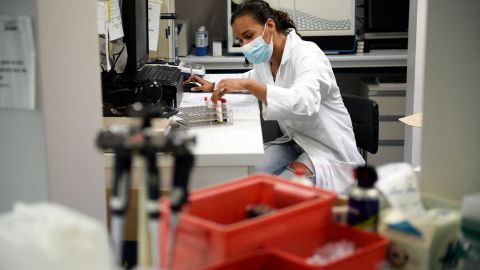 An employee works in an analysis laboratory of a Monkeypox vaccination site in Paris on August 3, 2022. - Despite a shortage of people to administer shots, the vaccination campaign is gaining momentum in the Paris region, which has been the epicentre of France's outbreak. (Photo by JULIEN DE ROSA / AFP) (Photo by JULIEN DE ROSA/AFP via Getty Images)