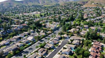 AGOURA HILLS, CALIFORNIA - MAY 06: An aerial view of homes in one of the many cities in Southern California where residents will be limited to one day per week of outdoor watering on May 6, 2022 in Agoura Hills, California. A water shortage emergency has been declared in Southern California with water restrictions beginning June 1st for 6 million residents amid drought conditions. (Photo by Mario Tama/Getty Images)