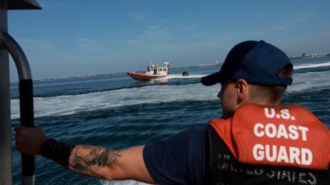 MIAMI BEACH, FLORIDA - JUNE 09: United States Coast Guard Petty Officer 3rd Class Boatswain's Mate Sam Flannery stands aboard a 33 foot response boat as it navigates through Biscayne Bay during a media event on June 09, 2022 in Miami Beach, Florida. The Coast Guard demonstrated its abilities to conduct a search and rescue mission. (Photo by Joe Raedle/Getty Images)