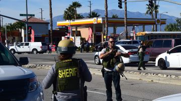 Armed Sheriff's department personel man a roadblock at Waterman Street near the site of a shooting took place on December 2, 2015 in San Bernardino, California. One or more gunman opened fire inside a building in San Bernardino in California, with reports of 20 victims at a center that provides services for the disabled. Police were still hunting for the shooter, saying one to three possible suspects were involved. Heavily armed SWAT teams, firefighters and ambulances swarmed the scene, located about an hour east of Los Angeles, as police warned residents away. AFP PHOTO / FREDERIC J. BROWN / AFP / FREDERIC J. BROWN (Photo credit should read FREDERIC J. BROWN/AFP via Getty Images)