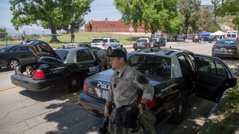 SAN BERNARDINO, CA - APRIL 10: Police officers seal off North Park Elementary School following a shooting on campus on April 10, 2017 in San Bernardino, California. Two people died, including the suspected shooter, and two children were wounded in the apparent murder-suicide attack. (Photo by David McNew/Getty Images)