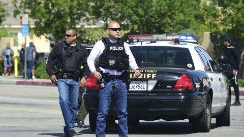 Police man an intersection May 11, 2018 following reports of shooting at Highland High School in Palmdale, 40 miles (65 kilometers) north of downtown Los Angeles. - Police arrested a man after reports of shootings at two schools near Los Angeles, the local sheriff's department and education officials said. The Los Angeles County Sheriff said one suspect had been detained "regarding the person with a gun" at Highland High School. Local news reports had earlier said that at least one person had been wounded. It was not immediately clear what type of weapon the man had. (Photo by Frederic J. BROWN / AFP) (Photo credit should read FREDERIC J. BROWN/AFP via Getty Images)