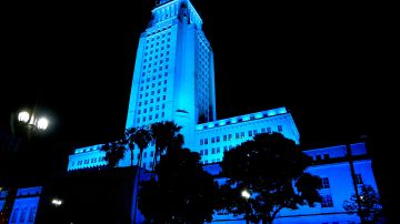 LOS ANGELES, - APRIL 16: A view of Los Angeles City Hall illuminated in blue on April 16, 2020 in Los Angeles, United States. Landmarks and buildings across the nation are displaying blue lights to show support for health care workers and first responders on the front lines of the COVID-19 pandemic. (Photo by Frazer Harrison/Getty Images)