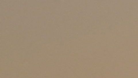 The sun sets behind people walking an afternoon hike in Los Angeles, California on July 12, 2021. - Wildfires were burning across more than one million acres of the western United States and Canada on July 12, 2021, as scorching temperatures held their grip on areas reeling from a brutal weekend heat wave. (Photo by Frederic J. BROWN / AFP) (Photo by FREDERIC J. BROWN/AFP via Getty Images)