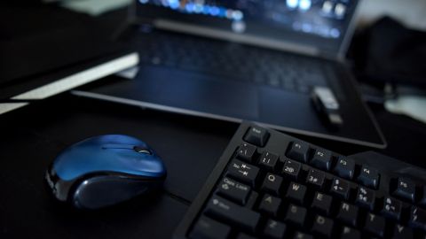 This photo illustration taken on August 13, 2021 shows a home office desk with a keyboard, a mouse and a laptop in Los Angeles, California. - In the United States, companies are delaying one after another the return of their employees to the office, worried about the new wave of contaminations with the spread of the Delta variant. (Photo by - / AFP) (Photo by -/AFP via Getty Images)