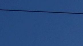 A scorching sun shines above power lines in Rosemead, California on August 31, 2022. - Temperatures as high as 112 degrees Fahrenheit (44 Celsius) were expected in some Los Angeles suburbs as a huge heat dome bakes a swathe of the western United States. The sweltering weather is expected to put huge demands on the already-stretched power grid, especially when people crank up the air conditioners during the broiling hours after work and school. (Photo by Frederic J. BROWN / AFP) (Photo by FREDERIC J. BROWN/AFP via Getty Images)