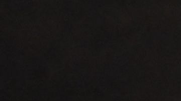 Las llamas del incendio Fairview se acercan a una casa, cerca de Hemet, en California.