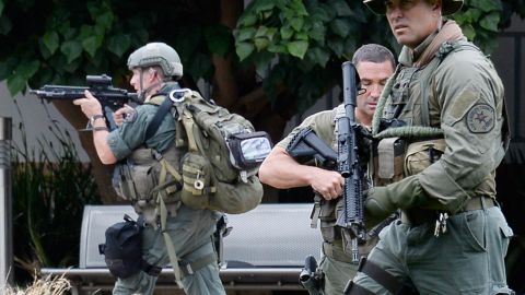 SANTA MONICA, CA - JUNE 07: Los Angeles County SWAT team members search the grounds of Santa Monica College near the library after multiple shootings were reported on the campus June 7, 2013 in Santa Monica, California. According to reports, at least three people have been injured, and a suspect was taken into custody. (Photo by Kevork Djansezian/Getty Images)