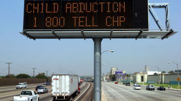 LOS ANGELES, CA - AUGUST 1, 2002: (FILE PHOTO) A Caltrans freeway sign over Interstate 5 flashes "child abduction 1 800 TELL CHP" in addition to the description of a suspect's vehicle as part part the statewide "Amber Alert" program August 1, 2002 in Los Angeles, California. Signs all across the state were used in the search for 17-year-old Jaqueline Marris and 16-year-old Tamera Brooks, who were kidnapped at gunpoint around 1 a.m. as they sat in seperate cars with male friends near Quartz Hill, west of Palmdale, California, according to sheriffs officers. Hours later an animal control officer in Kern County tipped Kern County sheriffs who shot Roy Ratliff to death during a rescue of the girls. U.S. President George W. Bush signed the Protect Act of 2003, or the Amber Alert legislation, during a Rose Garden ceremony April 30, 2003 in Washington, DC. The Amber Alert system notifies the public of child abductions in the critical early hours of the crime. (Photo by David McNew/Getty Images)