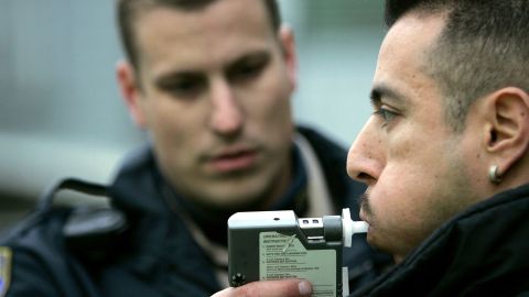 SAN FRANCISCO - DECEMBER 26: California Highway Patrol officer Mark Rossetti administers a breathalizer test to a man at a sobriety checkpoint December 26, 2004 in San Francisco, California. The California Highway Patrol reported a total of 1,481 driving under the influence arrests since the December 17 the start of the AVOID regional campaign against drunken driving. AVOID, a regional force of 125 police departments in the San Francisco Bay Area, runs its annual ANTI-DUI campaign from December 17 through January 2. (Photo by Justin Sullivan/Getty Images)