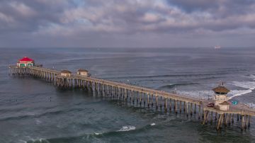 An aerial view shows the pier in Huntington Beach, California on May 02, 2020. - Orange County beaches will remain closed after a California Superior Court judge rejected a request May 1 to block California Governor Gavin Newsom's order to close local beaches during the coronavirus pandemic. (Photo by Apu GOMES / AFP) (Photo by APU GOMES/AFP via Getty Images)