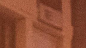 Firefighters gather near firetrucks after a fire in a single-story commercial building sparked an explosion in the Toy District of downtown Los Angeles on May 16, 2020. - At least 11 firefighters were injured in downtown Los Angeles when a fire in a commercial building sparked a major explosion and spread to nearby structures, fire officials said. Some 230 responders battled the blaze as it spread to other buildings in the area before it was extinguished around two hours after it began. (Photo by Apu GOMES / AFP) (Photo by APU GOMES/AFP via Getty Images)