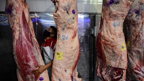 A butcher works at a butcher's shop in Liniers neighborhood, Buenos Aires, on 18 May 2021. - Argentine meat producers announced on Tuesday they would stop selling beef and veal for one week in response to a month-long government suspension on exports due to rising prices on the domestic market. (Photo by RONALDO SCHEMIDT / AFP) (Photo by RONALDO SCHEMIDT/AFP via Getty Images)