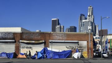 Tents housing the homeless line up in front of closed storefronts near downtown Los Angeles, California on February 16, 2022. - The annual census of people living on the streets experiencing homelessness will take place from February 22-24 in Los Angeles, home to one of the largest homeless populations in the United States. (Photo by Frederic J. BROWN / AFP) (Photo by FREDERIC J. BROWN/AFP via Getty Images)