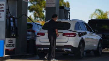SIGNAL HILL, CA - SEPTEMBER 21: A man pumps gas into his car at a Costco gas station on September 21, 2022 in Signal Hill, California. Gas prices have increased for the first time in almost 100 days. (Photo by Allison Dinner/Getty Images)