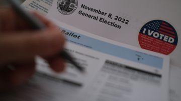 In this illustration photo a voter fills out their ballot ahead of November 8 midterm elections, in Los Angeles, October 24, 2022. - Victory in elections hinges on offering the right answers to questions that matter most. But voters shifting priorities have been harder than usual to pin down in this years US midterms campaign (Photo by Chris DELMAS / AFP) (Photo by CHRIS DELMAS/AFP via Getty Images)