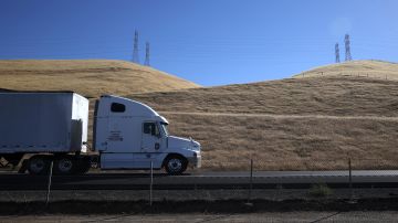 LOS BANOS, CALIFORNIA - MAY 25: A trucks drives by hills covered in dry grass along Highway 5 on May 25, 2021 in Los Banos, California. As California enters an extreme drought emergency, water is starting to become scarce in California's Central Valley, one of the most productive agricultural regions in the world. Farmers are facing a shortage of water to use on their crops as wells and reservoirs dry up. Some are pulling out water dependent crops, like almonds, or opting to leave acres fallow. (Photo by Justin Sullivan/Getty Images)