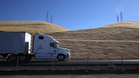 LOS BANOS, CALIFORNIA - MAY 25: A trucks drives by hills covered in dry grass along Highway 5 on May 25, 2021 in Los Banos, California. As California enters an extreme drought emergency, water is starting to become scarce in California's Central Valley, one of the most productive agricultural regions in the world. Farmers are facing a shortage of water to use on their crops as wells and reservoirs dry up. Some are pulling out water dependent crops, like almonds, or opting to leave acres fallow. (Photo by Justin Sullivan/Getty Images)