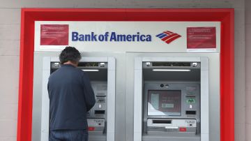 SAN FRANCISCO, CALIFORNIA - JULY 14: A Bank of America customer uses an ATM at a Bank of America branch office on July 14, 2021 in San Francisco, California. Bank of America reported second-quarter earnings that fell short of analyst expectations with a revenue decline of four percent to $21.5 billion. (Photo by Justin Sullivan/Getty Images)