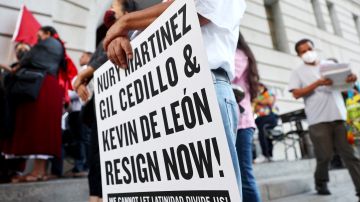 LOS ANGELES, CALIFORNIA - OCTOBER 12: Protestors demonstrate outside City Hall calling for the resignations of L.A. City Council members Kevin de Leon and Gil Cedillo in the wake of a leaked audio recording on October 12, 2022 in Los Angeles, California. L.A. City Council President Nury Martinez resigned today in the aftermath of the release of the profanity-laced recording which revealed racist comments amid a discussion of city redistricting. (Photo by Mario Tama/Getty Images)