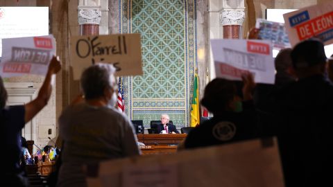 LOS ANGELES, CALIFORNIA - OCTOBER 25: New L.A. City Council President Paul Krekorian (C) presides near protestors as the council holds its first in-person meeting since he became president in the wake of a leaked audio recording on October 25, 2022 in Los Angeles, California. L.A. City Council President Nury Martinez resigned in the aftermath of the release of the profanity-laced recording which revealed racist comments amid a discussion of city redistricting. Embattled L.A. City Council member Kevin de Leon was not in attendance in person for the meeting. (Photo by Mario Tama/Getty Images)