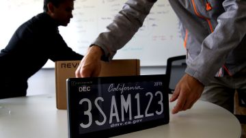 FOSTER CITY, CA - MAY 30: A digital license plate made by Bay Area company Reviver Auto, part of a pilot project with the state Department of Motor Vehicles, is displayed at Reviver Auto headquarters on May 30, 2018 in Foster City, California. California is the first state in the U.S. to test digital license plates on vehicles. According to the California State Department of Motor Vehicles, there are currently 116 cars in California that are part of a pilot program testing the new plates that will eventually be sold at auto dealerships for $699 plus installation costs. Digital plates are expected to roll out in Florida, Arizona, and Texas later this year. (Photo by Justin Sullivan/Getty Images)
