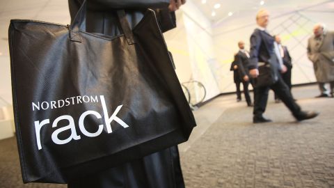 NEW YORK - MAY 11: A shopper carries a bag on opening day of the new Nordstrom Rack store May 11, 2010 in New York City. The 32,000-square-foot basement discount store in Manhattan's Union Square is Nordstrom's first store in New York City. (Photo by Mario Tama/Getty Images)