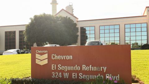 The Chevron logo is seen on the address sign outside the Chevron Products Company El Segundo refinery on January 26, 2022 in El Segundo, California. - The oil refinery supplies motor vehicle fuels including gasoline and diesel to Southern California as well as jet fuel for aircraft at Los Angeles International Airport (LAX). (Photo by Patrick T. FALLON / AFP) (Photo by PATRICK T. FALLON/AFP via Getty Images)