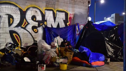 TOPSHOT - A homeless encampment is pictured on the streets of Los Angeles, California on February 24, 2022, as volunteers participate on the third night of the Greater Los Angeles Homeless Count on February 24, 2022 in Los Angeles, California. - he annual count in a city with one of the largest homeless communities in the country is done to obtain an accurate count of unhoused people across Los Angeles County. (Photo by Frederic J. BROWN / AFP) (Photo by FREDERIC J. BROWN/AFP via Getty Images)