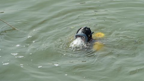 A Scuba diver joins in conducting search operations on November 1, 2022, days after a bridge across the river Machchhu collapsed on October 30, 2022, at Morbi in Indias Gujarat state. - Rescue divers were still searching for more bodies in the Machchhu river on November 1, with 134 people confirmed dead -- among them 47 children. (Photo by SAM PANTHAKY / AFP) (Photo by SAM PANTHAKY/AFP via Getty Images)