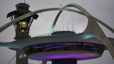 LOS ANGELES, CA - APRIL 10: The old futuristic Encounter restaurant and the Los Angeles Internationl Airport (LAX) control tower are located at the heart of the U-shaped terminal on April 10, 2004 in Los Angeles, California. Los Angeles International Airport has unveiled a $9 billion plan, backed by LA Mayor Jim Hahn, to attempt to transform itself into the nation's highest-security airport. Changes would require passengers to pass through two screening checkpoints, equipped with the latest explosive-detection technologies, as casino-style security cameras would keep watch over them. Curbside pickup and drop-off of passengers at the terminal would be banned. Travellers would have to be let off a mile from the airport where they would go through security screening then ride a "people mover" train to the airport. (Photo by David McNew/Getty Images)