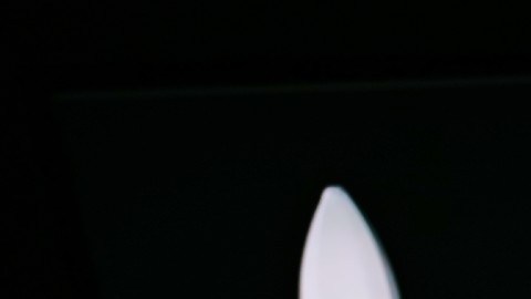 Imagen de una pantalla con letras negras del nombre de la compañía Astra y la silueta de un cohete espacial en el fondo.