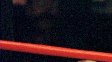 Mills Lane, entre Evander Holyfield y Mike Tyson.