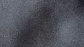 Police tape is seen in front of a police vehicle as Manuel Oliver displays a banner calling on government officials to prioritize gun violence prevention from a construction crane near the White House in Washington, DC, on February 14, 2022. - Olivers son Joaquin Oliver was killed in the Parkland School shooting four years ago today. (Photo by Stefani Reynolds / AFP) (Photo by STEFANI REYNOLDS/AFP via Getty Images)