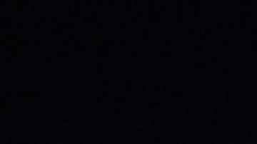 Hinchas de Argentina en Qatar 2022 con una imagen de Diego Maradona.