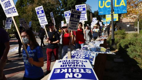 LOS ANGELES, CALIFORNIA - NOVEMBER 15: Union academic workers and supporters march and picket at the UCLA campus amid a statewide strike by nearly 48,000 University of California unionized workers on November 15, 2022 in Los Angeles, California. The strikers are calling for improved wages and benefits at the 10 UC public university campuses across California. (Photo by Mario Tama/Getty Images)