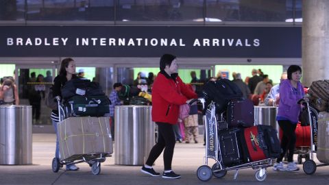 LOS ANGELES, CA - FEBRUARY 19: International air travelers arrive at Tom Bradley International Terminal at Los Angeles International Airport (LAX) on February 19, 2014 in Los Angeles, California. The Department of Homeland Security today alerted airlines to a potential new shoe-bomb threat, urging them to pay extra attention to passenger shoes on flights to the US from overseas. Passengers may also be subject to increased pat downs and full-body screenings. (Photo by David McNew/Getty Images)