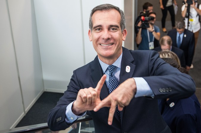 Los Angeles Mayor Eric Garcetti does the L.A.prior to present the Los Angeles 2024 bid before members of the International Olympic Committee (IOC) on July 11, 2017 in Lausanne. The International Olympic Committee is poised to hand the 2024 and 2028 Summer Games to Paris and Los Angeles on July 11 with a landmark double hosting deal set to be approved. / AFP PHOTO / SEBASTIEN BOZON (Photo credit should read SEBASTIEN BOZON/AFP via Getty Images)
