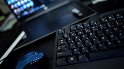 This photo illustration taken on August 13, 2021 shows a home office desk with a keyboard, a mouse and a laptop in Los Angeles, California. - In the United States, companies are delaying one after another the return of their employees to the office, worried about the new wave of contaminations with the spread of the Delta variant. (Photo by - / AFP) (Photo by -/AFP via Getty Images)