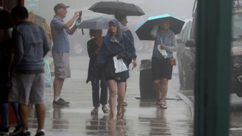 JULIAN, CA - SEPTEMBER 09: Visitors walk in Downtown Julian as winds and rain fall on September 9, 2022 in Julian, California. The Tropical Storm, which produced winds up to 109 MPH in the Eastern part of San Diego County, downed several trees and power lines and caused flooding. (Photo by Sandy Huffaker/Getty Images)