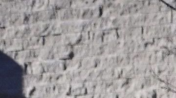 A makeshift memorial of flowers, candles and balloons grows outside City Hall in Monterey Park, California on January 24, 2023 as a man writes a note on one of 11 crosses displayed for victims of the mass shooting late on January 21. - Huu Can Tran, the 72-year-old Asian immigrant who killed 11 people before shooting himself as police moved in on him was once a regular at the California dance club where a tragic gun massacre unfolded as people celebrated the lunar new year. Tran used a semi-automatic pistol to spray 42 bullets around the Star Ballroom Dance Studio in Monterey Park, an Asian-majority city near Los Angeles. (Photo by Frederic J. BROWN / AFP) (Photo by FREDERIC J. BROWN/AFP via Getty Images)