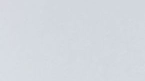 A man writes a message on a cross, one of 11 displayed for the victims killed late on January 21, outside City Hall in Monterey Park, California on January 24, 2023 at a makeshift memorial of flowers, candles and balloons. - Huu Can Tran, the 72-year-old Asian immigrant who killed 11 people before shooting himself as police moved in on him was once a regular at the California dance club where a tragic gun massacre unfolded as people celebrated the lunar new year. Tran used a semi-automatic pistol to spray 42 bullets around the Star Ballroom Dance Studio in Monterey Park, an Asian-majority city near Los Angeles. (Photo by Frederic J. BROWN / AFP) (Photo by FREDERIC J. BROWN/AFP via Getty Images)