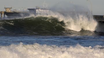 SAN DIEGO, CALIFORNIA - JANUARY 11: Large waves hit the Ocean Beach Pier causing minor damage as high surf advisories were in effect along San Diego beaches on January 11, 2021 in San Diego, California. The high surf advisories remain in effect until mid-day January 12, 2021. (Photo by Sean M. Haffey/Getty Images)