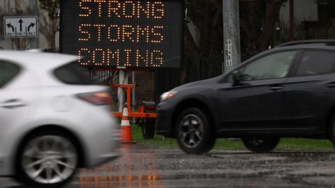 SAUSALITO, CALIFORNIA - JANUARY 07: Cars drive by a sign warning of storms hitting the Bay Area on January 07, 2023 in Sausalito, California. The San Francisco Bay Area continues to get drenched by powerful atmospheric river events that have brought high winds and flooding rains. The storms have toppled trees, flooded roads and cut power to tens of thousands. Storms are lined up over the Pacific Ocean and are expected to bring more rain and wind through next week. (Photo by Justin Sullivan/Getty Images)