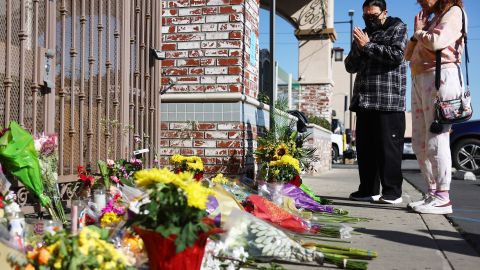 MONTEREY PARK, CALIFORNIA - JANUARY 23: People stand at a makeshift memorial outside the scene of a deadly mass shooting at a ballroom dance studio on January 23, 2023 in Monterey Park, California. An eleventh person has died and ten more were injured at the studio near a Lunar New Year celebration on Saturday night. A candlelight vigil for the victims will be held in the predominantly Asian American community of Monterey Park tonight. (Photo by Mario Tama/Getty Images)