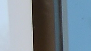 A security guard stands in position as Porter Ranch residents, seen reflected on the glass door, await entry to the SoCal Gas Community Resource Center in Porter Ranch, California on January 8, 2016, where residents have been going to lodge complaints and seek an alternative housing situation from their homes near where natural gas leaking from a well has sickened and displaced thousands of residents. More than 1,600 odor complaints have been lodged by residents with the air district since October 23, 2015 when the leak began. Repeated efforts to stop the leak by pumping liquid and mud down the well have failed and the gas company is now drilling a relief well to intercept and plug the damaged well.AFP PHOTO/FREDERIC J. BROWN / AFP / FREDERIC J. BROWN (Photo credit should read FREDERIC J. BROWN/AFP via Getty Images)