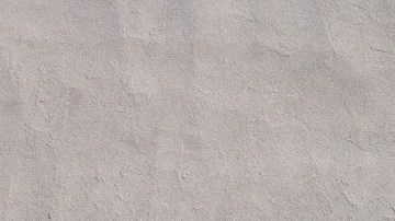 Imagen de un logotipo de la marca Sams, en color azul, colocado sobre un muro de color gris.