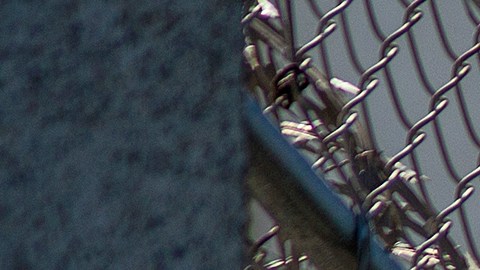 LOS ANGELES, CA - JULY 14: Razor wire is seen on the Metropolitan Detention Center prison as mass arrests by federal immigration authorities, as ordered by the Trump administration, were supposed to begin in major cities across the nation on July 14, 2019 in Los Angeles, California. The U.S. Immigration and Customs Enforcement was expected to be target hundreds of Angelenos for deportation, plus family members and others they encounter and suspect of being undocumented. The city of Los Angeles declared itself a sanctuary city to reflect its policy since the 1970s of not allowing police to help immigration officials because the city wants its immigrant populations to not be afraid to cooperate with police or call in crimes and emergencies. Elected officials and activists have continued to lash out against the raids. (Photo by David McNew/Getty Images)