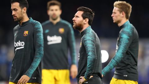 Sergio Busquets junto a Lionel Messi en el FC Barcelona.